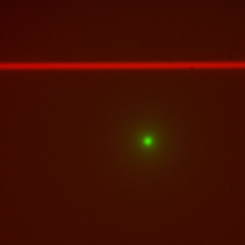 Look at red beam only with scanner iris closed down all the way so laser is a “pencil beam.” Use adjustment
screws on the scanner’s dichroic mirror holder to make the pencil beam straight horizontally and
in focus along the beam. Adjust imaging objective bushing focus as necessary to keep the beam in focus as you
make changes to the beam steering adjusters.